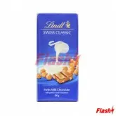 BARRA DE CHOCOLATE LINDT CLASSICA AO LEITE C/ AVELÃS 100G